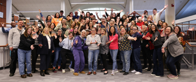All Library staff excitedly holding the 2025 GFACC award.